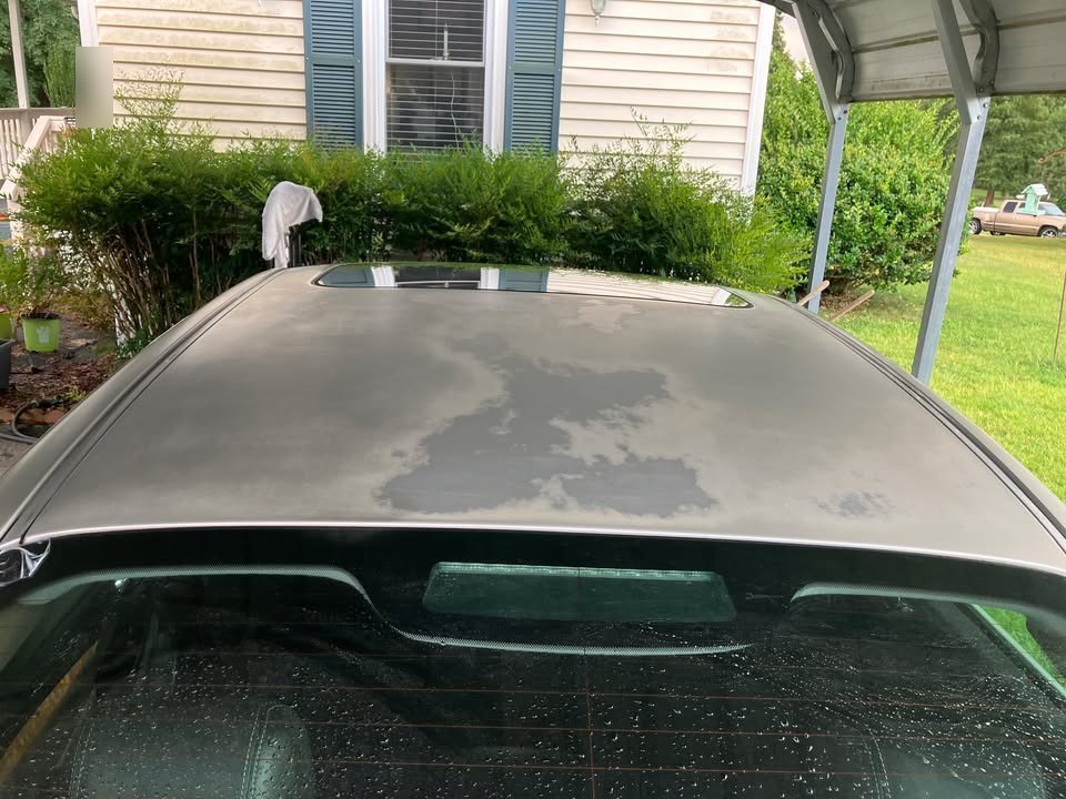 Before: heavily oxidized, chalky and blotchy Jaguar roof with dark faded patches before Gleam Team paint restoration in Charlotte NC