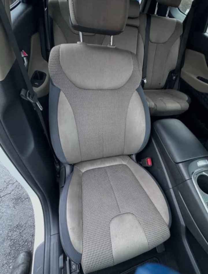 After: clean two-tone cloth SUV front seat following hot-water extraction and shampoo by Gleam Team Mobile Detailers in Charlotte NC